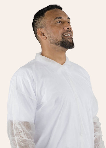 Man wearing a white IDAS Group Labcoat against a plain background